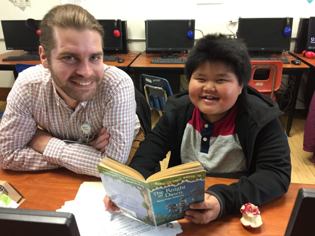 2022 Ambassadors of Mentoring Patrick and Bawmu, reading during their Everybody Wins! power lunch!